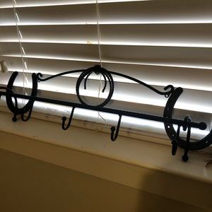 Horseshoe with rope coat rack